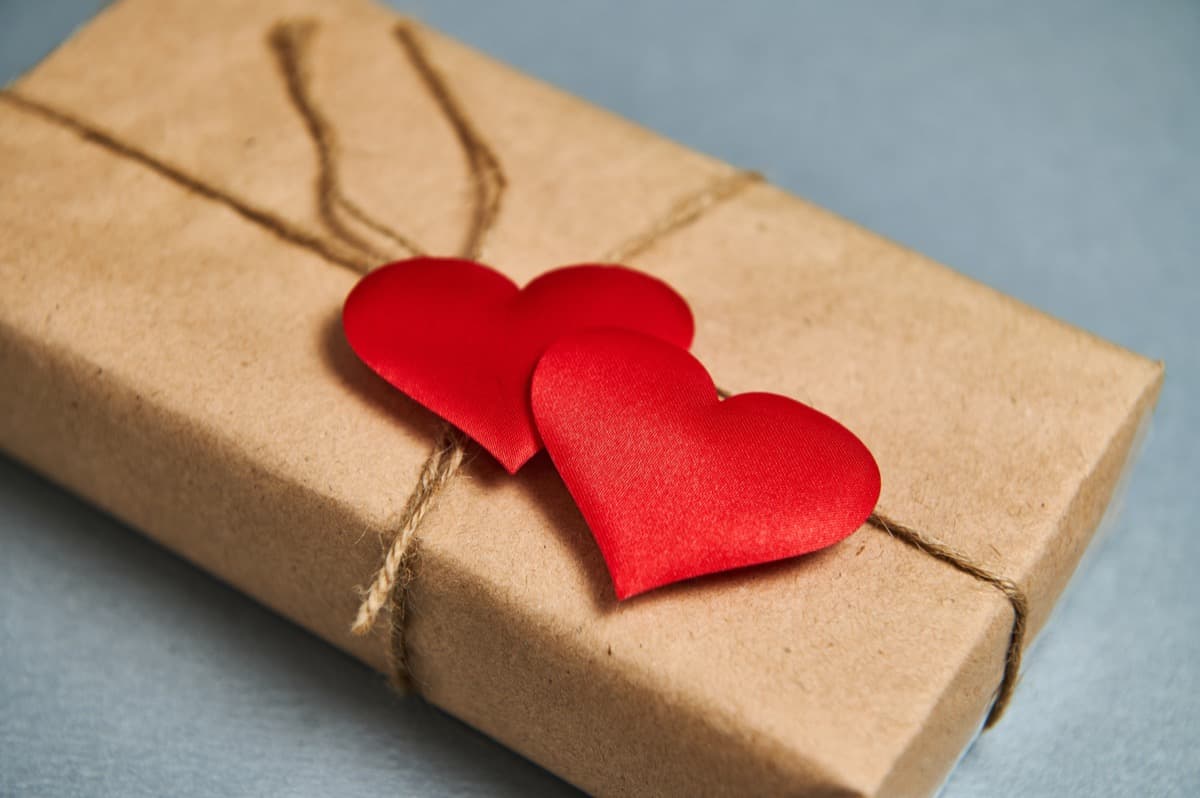 Romantic gift wrapped in kraft paper with red hearts, perfect for anniversary celebrations