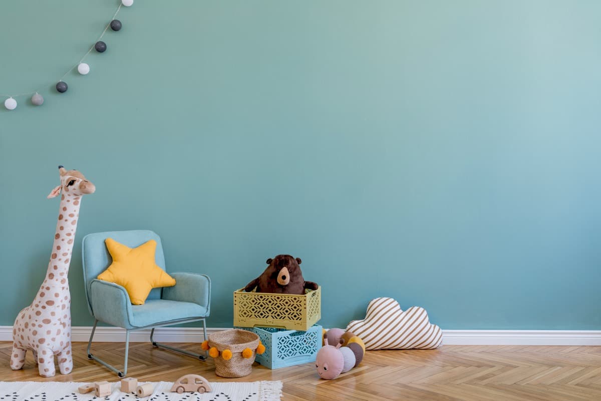 Bright children's bedroom with toys shelves and colourful decor
