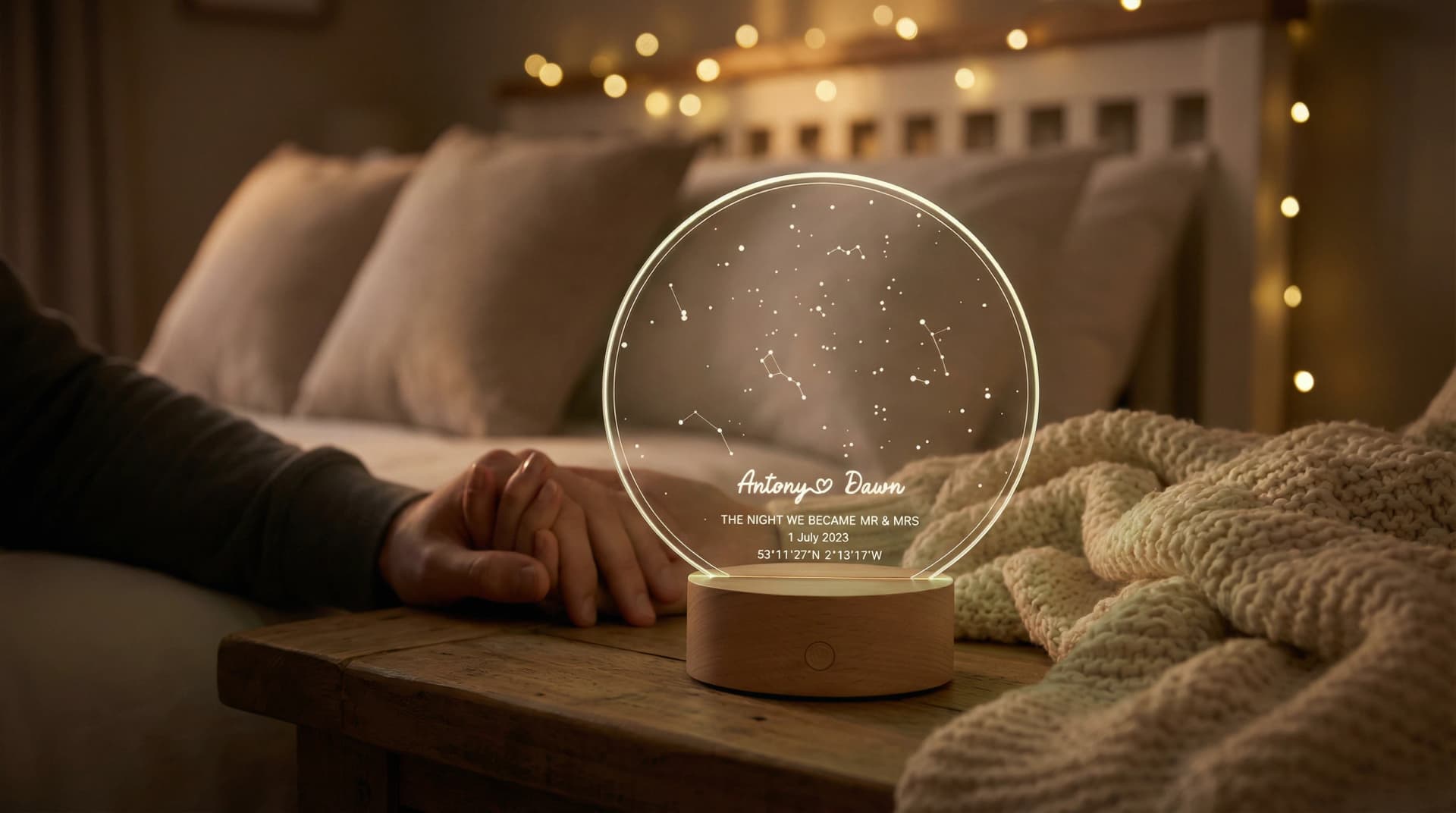 Star Map LED Night Light showing Antony and Dawn's wedding night sky glowing on a bedside table with fairy lights and cosy blankets